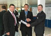 Photographs of Professors Dougal Drysdale and Jose Torero together with two unknown men at the UoE open day on Fire Safety Engineering, in the Erskine Williamson Building, King's Buildings. Photographs taken on the 1st of November 2005.